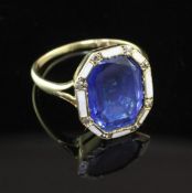 An attractive, gold, sapphire diamond and white enamel dress ring, of octagonal form, the central