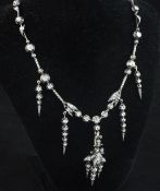 A 19th century French 18ct white gold and diamond drop pendant necklace, of foliate design, the