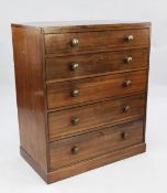 A Regency mahogany chest, of five graduated long drawers with brass bun handles, on plinth base, W.