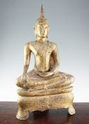 A large Thai gilt bronze seated figure of Buddha, on a shaped throne, 66.5cm