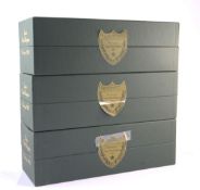Three bottles of Dom Perignon including two 1990 and one 1993; each individually boxed, all of