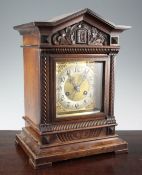 An Edwardian walnut mantel clock, in architectural case, 16in.