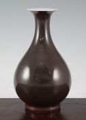 A Chinese sang-de-boeuf glazed pear shaped vase, Yuhuchunping, 18th century, the glaze of brown tone