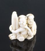 A Japanese ivory netsuke of seated Ashinaga and Tenaga, Meiji period, with some stained detail to