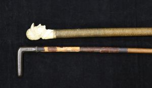 A late 19th / early 20th century riding crop, the carved ivory handle modelled as a jockey's head,