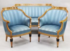 A Biedermier stain birch three piece suite, with bell flower inlay, upholstered in blue stripe