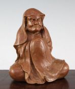 A Japanese stoneware seated figure of Daruma, 19th century, 18.5cm