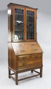 An unusual oak and specimen wood bureau bookcase, with chevron bandings, fitted with a pair of