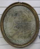 A 19th century oval needlework map sampler, detailing England and Wales within a floral border and