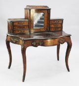 A late Victorian walnut and marquetry inlaid serpentine bonheur du jour, the raised superstructure