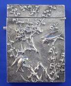 An early 20th century Chinese silver card case, embossed with birds amongst bamboo, unmarked, 3.5in,