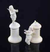 A pair of late 19th / early 20th century European carved ivory figures of winged cherubs, each on