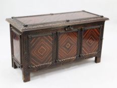 An Anglo Indian coromandel chest, with hinged lid, carved with fruiting vines and rope twist