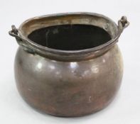 A large 19th century copper cauldron, with iron swing handle, 22.5in.