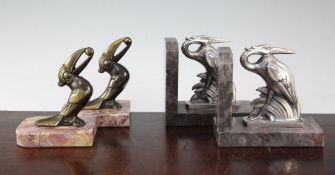 A pair of French Art Deco silvered metal heron bookends, 5.5in., together with a similar pair of