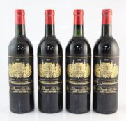 Four bottles of Chateau Palmer 1977, Margaux, all base of neck, one with tear to lower middle of