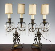 A pair of Empire style twin branch lustre drop table lights, with scrolling winged beast columns