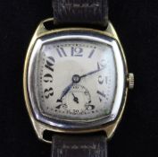 A gentleman's stylish mid 1920's 18ct gold manual wind wrist watch, with silvered dial, tumbling