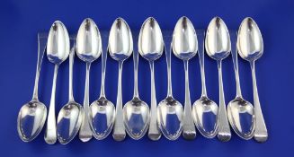 A set of fourteen George III silver Old English pattern table spoons, with engraved armorial,