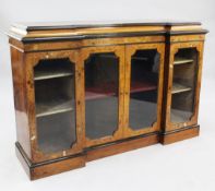 A Victorian walnut and marquetry inlaid side cabinet, with inverted breakfront fitted two glazed