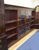 A large Edwardian mahogany bookcase, with two central astragal glazed doors flanked by open