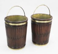 A pair of large mahogany brass bound peat buckets, with twisted brass swing handles, H.2ft 5in.
