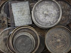 A large collection of Japanese bronze hand mirrors, 19th century, thirty one of circular form cast