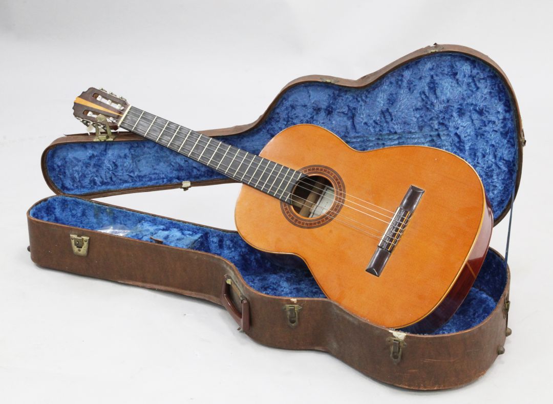 A Spanish classical guitar by Manuel G. Contreras, c.1973, together with a brown carry case