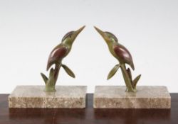 A pair of French Art Deco cold painted bronze bookends, modelled as humming birds, on marble