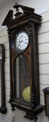 A late 19th century walnut and ebony Vienna wall clock, in architectural case with enamelled Roman