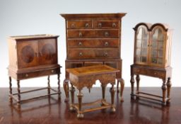 A Fergus Lane miniature Queen Anne style double dome top bookcase, complete with miniature
