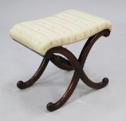 A Victorian rosewood X frame stool with Regency striped upholstered seat, some repairs,