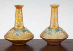 A pair of Bohemian enamelled lustre bottle vases, early 20th century, decorated with snowdrops and