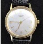 A gentleman's early 1960's 9ct gold Longines manual wind wrist watch, the silvered dial with baton