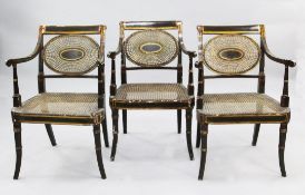 A set of three Regency John Gee open armchairs, with bronze and parcel gilt painted decoration, with