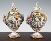 A pair of John Bevington floral encrusted twin handled vases, late 19th century, in Meissen style,