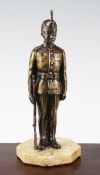 An early 20th century patinated military bronze model of a Kings Royal Rifle Corps soldier, on a