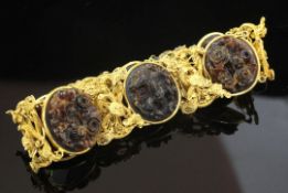 An early 20th century Chinese high carat gold filigree and tortoiseshell bracelet, with pierced