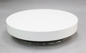 A Cattelean Italia circular white fibre glass coffee table, with tubular chrome base, W.3ft 11.5in.