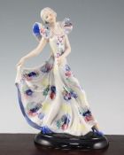 A W. Goebel Art Deco figure of a lady, 1930's, the dancing figure holding one pleat of her