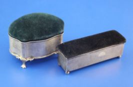 Two Edwardian silver trinket boxes, of serpentine or rectangular form, both with fitted interiors,