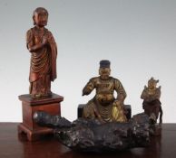 A Chinese gilt lacquered wood seated figure of Guandi, 18th / 19th century, and three other