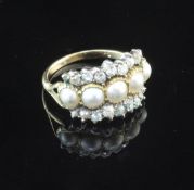 An early 20th century gold, split pearl and diamond half hoop dress ring, set with five graduated