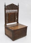 A North Indian Simla carved and pierced hardwood chair, the back with foliate pierced panels and a