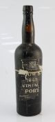 A bottle of Dow 1945, high fill, remnants of label, no capsule, cork appears dry and sound, good