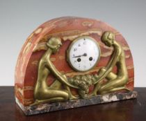 A French Art Deco rouge marble and bronze mantel clock, with circular arabic dial, 10in.