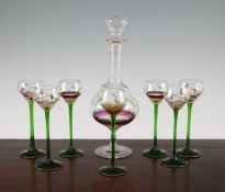 A Theresienthal eight piece enamelled glass liqueur set, c.1902, the bowls and base of the