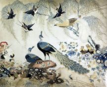 A Chinese embroidered silk picture of birds amid rockwork and foliage, late 19th / early 20th