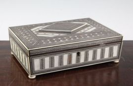 An Indian ivory and sadeli rectangular work box, the lid with raised lozenge panel opening to reveal