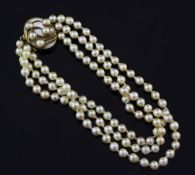 A 1990's triple strand cultured pearl choker necklace with a stylish mother of pearl set 18ct gold